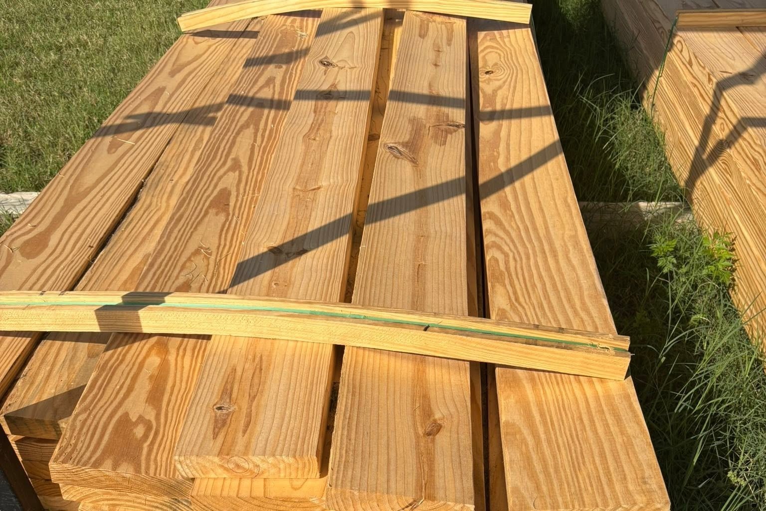 Bundle of number two Southern Yellow Pine two by eight boards with the mill tag showing