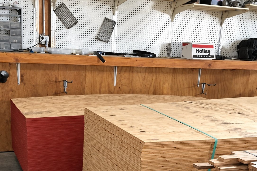 Stacked plywood and OSB sheets inside the building supply store