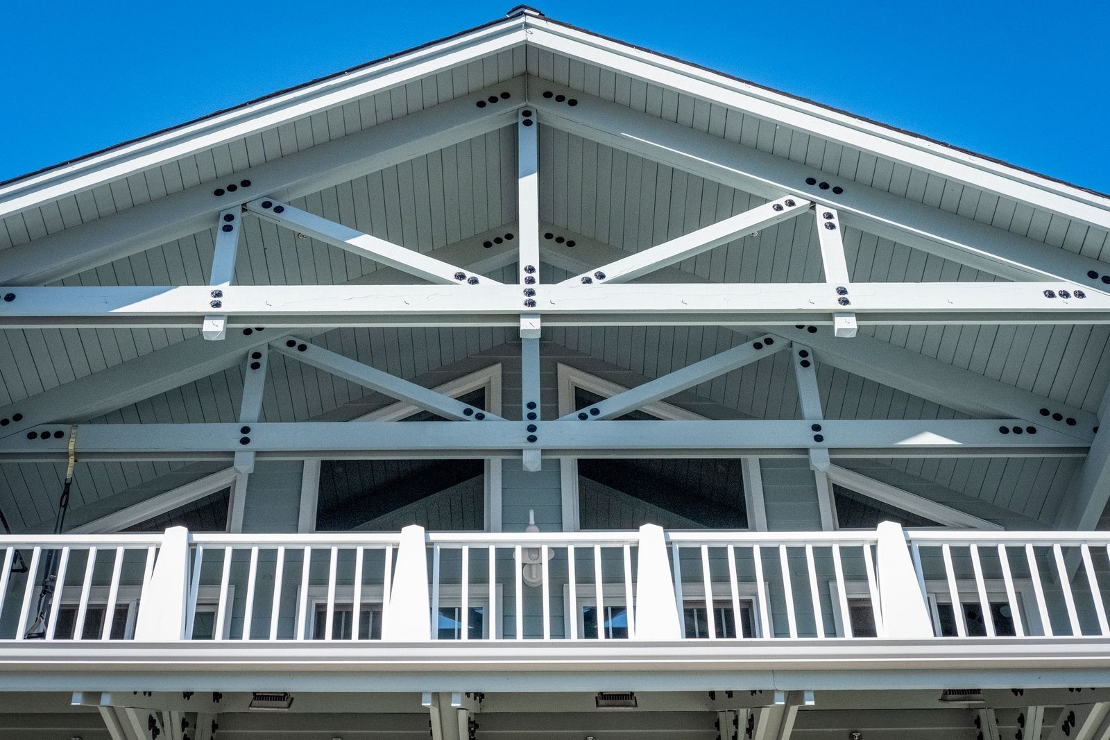 New timber roof trusses standing on a building under a blue sky