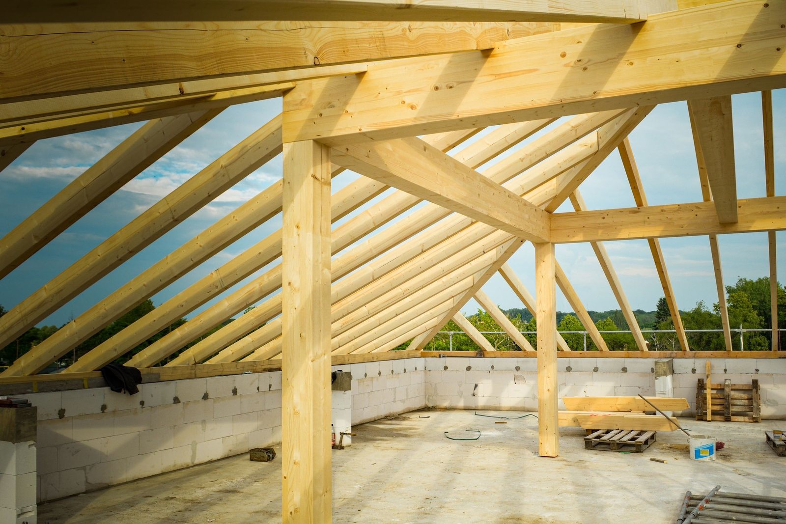 Timber post frame of a new shop building going up on a concrete slab